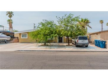 Charming single story home featuring mature trees, desert landscaping, and a spacious driveway at 304 S Crestline Dr, Las Vegas, NV 89107