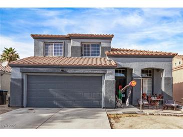 Charming two-story home with a two-car garage and a well-maintained exterior, perfect for families or first-time buyers at 4919 Rancho Domingo Ct, North Las Vegas, NV 89031