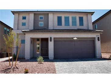 Contemporary two-story home featuring a two-car garage and desert landscaping at 6837 Crimson Lily St, Las Vegas, NV 89139