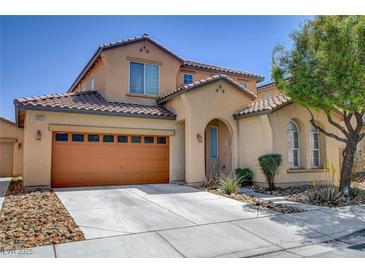 Charming two-story home featuring a two-car garage, desert landscaping, and an inviting arched entryway at 8022 Severn Valley St, Las Vegas, NV 89139