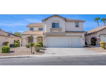 Two-story home featuring a three-car garage, well-manicured landscaping, and a neutral color palette at 8321 Gorsky Ave, Las Vegas, NV 89131