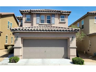 Charming two-story home with a gray garage door, landscaped front yard and visible house number at 8626 Anderson Dale Ave, Las Vegas, NV 89178