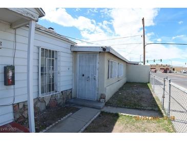 Charming single story home featuring unique stone accents, gated windows, and proximity to nearby city amenities at 10 E Bonanza Rd, Las Vegas, NV 89101