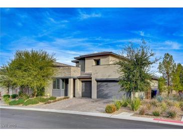 Contemporary two-story home with three-car garage and desert landscaping at 12355 Grey Dunes Ave, Las Vegas, NV 89138