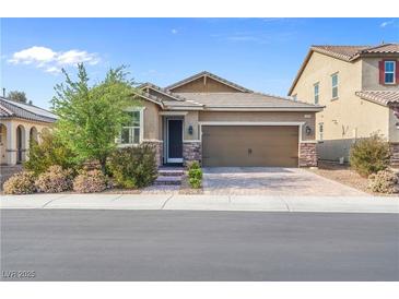 Charming single-story home with a well-manicured lawn and a two-car garage in a quiet neighborhood at 2924 Duverney Ave, Henderson, NV 89044