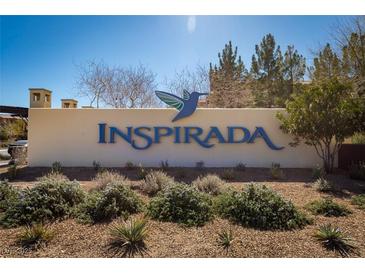 Community sign reading Inspirada set amongst desert landscaping under a clear blue sky at 3166 Via Da Vinci, Henderson, NV 89044