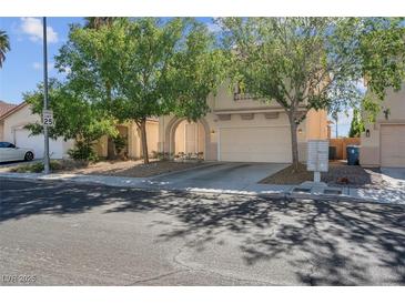 Charming home featuring a two-car garage, drought tolerant landscaping and covered entry at 3186 Lapis Beach Dr, Las Vegas, NV 89117