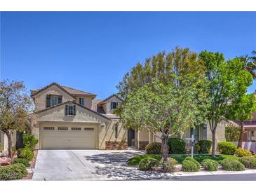 Charming two-story home with neutral color palette, landscaped yard, and three car garage at 3636 Chelsea Gardens Dr, Las Vegas, NV 89135