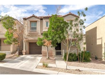 Charming two-story home with a well-maintained lawn and a private two car garage at 9100 Balcony Trellis Ave, Las Vegas, NV 89149