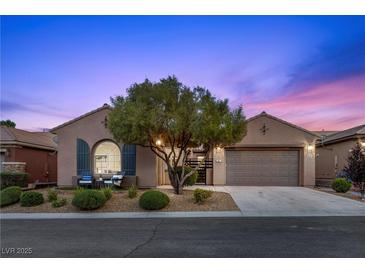 Charming single-story home with desert landscaping and a two-car garage, perfect for comfortable living at 940 Viscanio Pl, Las Vegas, NV 89138
