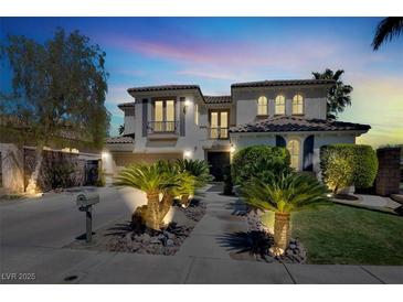 Elegant two-story home with manicured front yard and inviting curb appeal in a peaceful neighborhood at , Las Vegas, NV 89135
