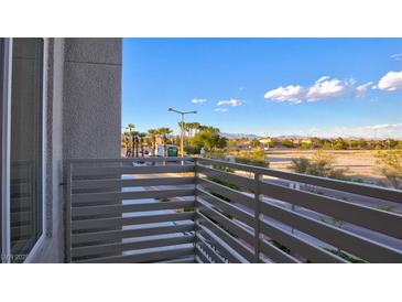 Balcony overlooking street with desert and mountain views in the background at 1163 Blossom Point St, Las Vegas, NV 89135