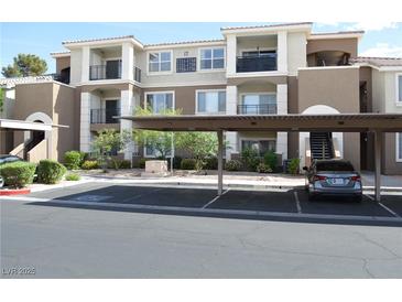 Beautiful condo building with covered parking and well-maintained landscaping at 2900 Sunridge Heights Pkwy # 1733, Henderson, NV 89052
