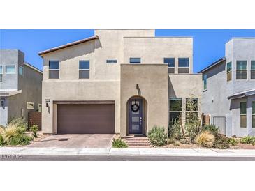 Contemporary two-story home featuring desert landscaping, a two-car garage, and a welcoming front entry at 3216 Monte Luna Ave, Henderson, NV 89044