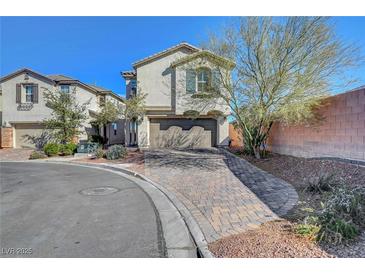 Charming two-story home featuring a two-car garage and nicely landscaped front yard at 7870 Formitch Ct, Las Vegas, NV 89166