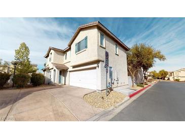 Charming two-story home with a two-car garage and landscaped front yard at 10245 Missouri Meadows St, Las Vegas, NV 89183