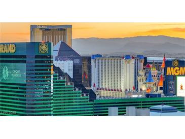A vibrant view of the Las Vegas Strip at sunset featuring the MGM Grand, Luxor, and Excalibur hotels at 125 E Harmon Ave # 2814/2816, Las Vegas, NV 89109