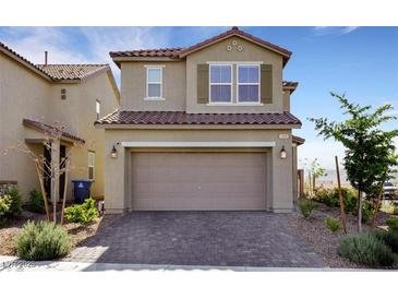 Charming two-story home featuring a tiled roof, two-car garage, and well-maintained landscaping at 2849 Mincio St, Henderson, NV 89044