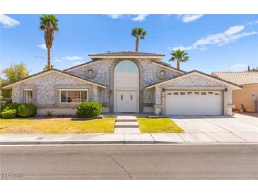 Stunning single-Gathering home with well-manicured landscaping and a welcoming two-car garage at 313 Firestone Dr, Las Vegas, NV 89145