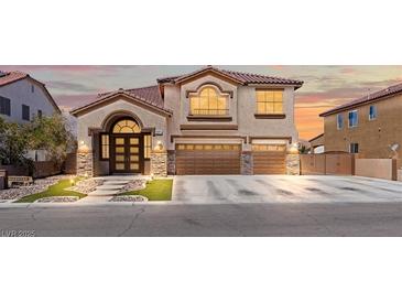 Inviting two-story home featuring a three-car garage and elegant architectural details at 885 Violet Hill St, Las Vegas, NV 89110