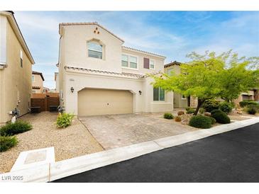 Charming two-story home with a two car garage and low maintenance desert landscaping at 8929 Sleepy Panda Ave, Las Vegas, NV 89148