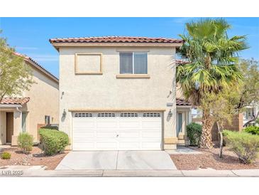 Two-story home featuring a two-car garage, stucco siding, and a red tile roof at 3314 Villa Fiori Ave, Las Vegas, NV 89141