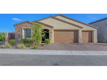 Charming single-story home featuring a three-car garage and well-maintained landscaping in a desirable neighborhood at 3495 Luca Point Ave, Henderson, NV 89044