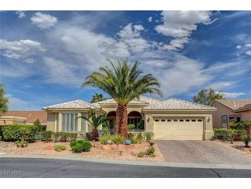 Charming single-story home featuring a desert landscape and a two-car garage at 4134 Riva De Tierra Ln, Las Vegas, NV 89135
