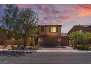 Charming two-story home with desert landscaping, brown exterior, and convenient three-car garage at 7761 Boyd Ave, Las Vegas, NV 89179
