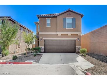 Charming two-story home featuring a well-manicured front yard and a spacious two-car garage at 8783 Halcon Ave, Las Vegas, NV 89148