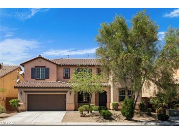 Charming two-story home featuring a two-car garage and low maintenance landscaping at 10281 Wolves Den Ln, Las Vegas, NV 89178