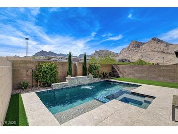 Backyard pool with a view of mountains on a sunny day at 2115 Noble Perch St, Las Vegas, NV 89138