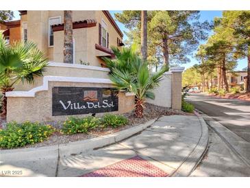 Villa del Sol community sign surrounded by lush landscaping and mature trees in a well-maintained neighborhood at 2801 N Rainbow Blvd # 102, Las Vegas, NV 89108
