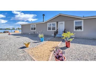 Charming single-story home with low-maintenance landscaping and a welcoming front entrance at 3611 W Horn Rd, Pahrump, NV 89048