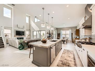 Spacious, modern kitchen with stainless steel appliances and a large center island for cooking and entertaining at 421 Malpaso St, Las Vegas, NV 89138