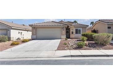 Charming home featuring a tile roof, low-maintenance landscaping and a two-car garage at 5965 Sierra Medina Ave, Las Vegas, NV 89139