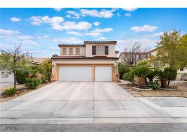 Charming two-story home with a spacious driveway and an attached two-car garage at 10143 Canyon Hills Ave, Las Vegas, NV 89148