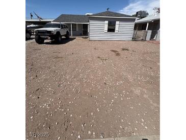 Cozy single-story home with a gravel front yard and ample parking space for multiple vehicles or recreational equipment at 102 Fir St, Henderson, NV 89015