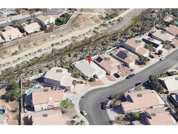 An aerial view shows the property's location in a well-maintained community with mature landscaping and nearby waterway at 1768 Saint Thomas Dr, Henderson, NV 89074