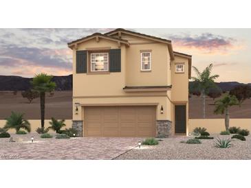 Charming two-story home features a two-car garage, neutral paint, desert landscaping, and decorative stone accents at 261 Kobuk Ave, Henderson, NV 89011