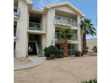 Charming two-story condo with desert landscaping and lovely balconies, providing a serene outdoor retreat at 3550 Bay Sands Dr # 2063, Laughlin, NV 89029