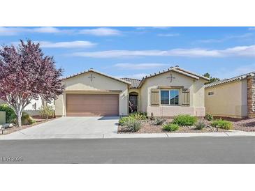 Inviting single-story home with a two-car garage, desert landscaping, and neutral color palette at 5226 Lignum Ave # 1, Pahrump, NV 89061