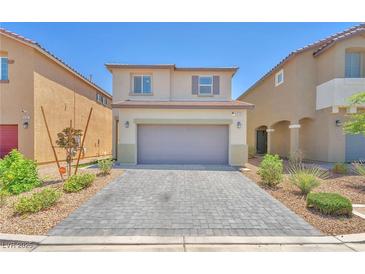 Charming two-story home featuring a gray driveway, neutral exterior, and well-maintained landscaping, providing delightful curb appeal at 9198 Rolling Sky Dr, Las Vegas, NV 89178
