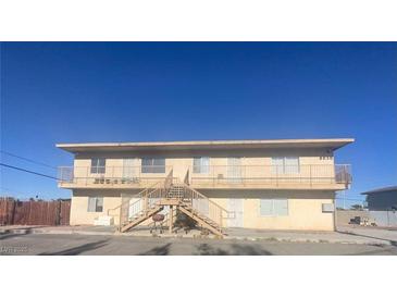 Two-story building with open balcony, and outside stairs at 4030 E Carey Ave, Las Vegas, NV 89115