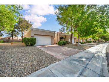 Well-maintained single-story home with a two-car garage and drought-tolerant landscaping at 8904 Evening Star Dr, Las Vegas, NV 89134