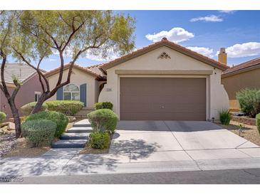 Charming single-story home featuring a well-maintained front yard and two-car garage at 11249 Revelry Ln, Las Vegas, NV 89138