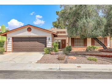 Charming single-story home featuring a well-maintained front yard, brown shutters, and a two-car garage at 3920 Autumn St, Las Vegas, NV 89120