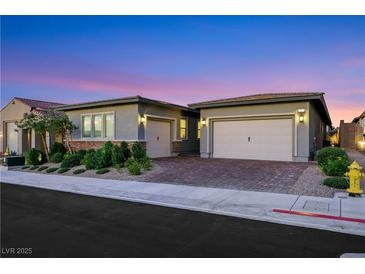 Charming single-story home with a two-car garage and well-maintained landscaping at 712 Webber Park St, Henderson, NV 89011