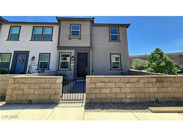 Charming townhome featuring modern architecture, a gated front yard, and a well-maintained exterior at 756 Sleeping City Ave, Henderson, NV 89015