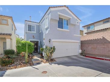 Charming two-story home featuring a two-car garage and low-maintenance landscaping at 2707 Commitment Ct, North Las Vegas, NV 89031